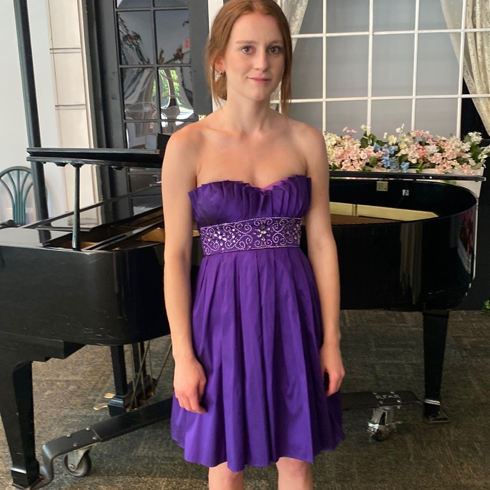 Fun purple strapless mini cocktail dress.